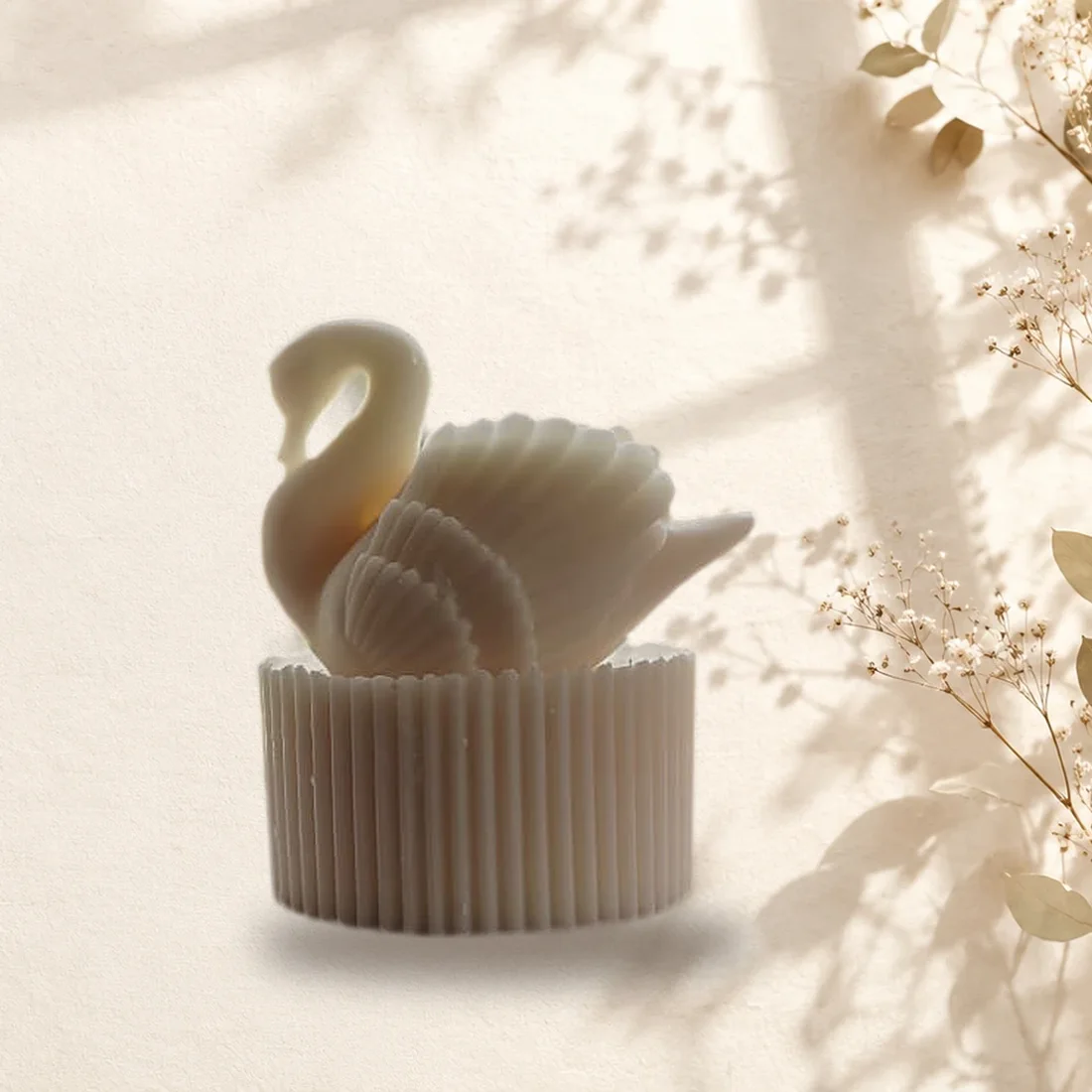 Handmade ivory swan candle with a ribbed base